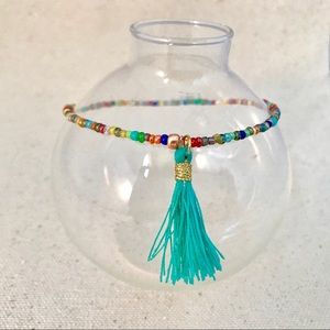 Stretch beaded anklet multicolor accent tassel